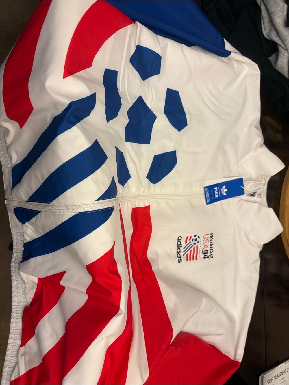 adidas Kids One-Piece Bodysuit in White with Red & Blue Graphics
